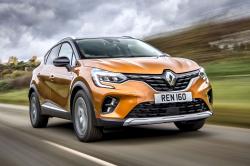 Orange Renault Captur front right driving