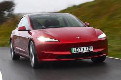 Tesla Model 3 front right driving