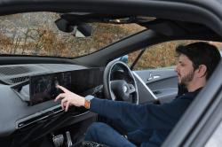 Dan using the iX's infotainment system