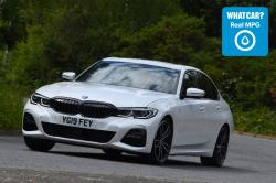 White BMW 3 Series cornering with Real MPG logo