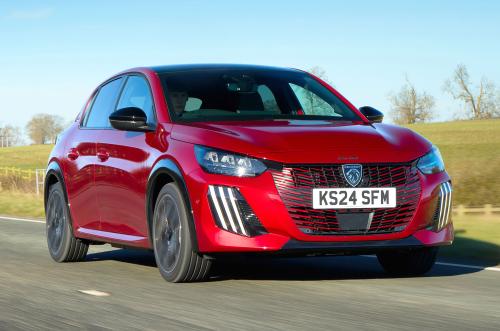 Red Peugeot 208 front right driving