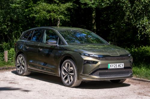 Front 3/4 shot of a green new Skoda Enyaq with tech deck face